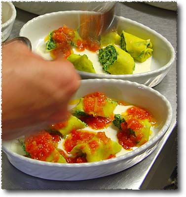 Making Crespelle alla Fiorentina: Saucing Sliced Crepelle with Tomato Sauce